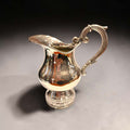 Jarra de metal plateado antigua con asa decorativa - Cositas Antiguas – La Guadaña, Anticuarios Online en Jerez , vender antigüedades, muebles antiguos