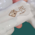 Figura perro NAO Lladró porcelana sentado - Cositas Antiguas – La Guadaña, Anticuarios Online en Jerez , vender antigüedades, muebles antiguos