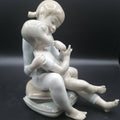 Figura de porcelana niño y niña sentada | Elegancia - Cositas Antiguas – La Guadaña, Anticuarios Online en Jerez , vender antigüedades, muebles antiguos